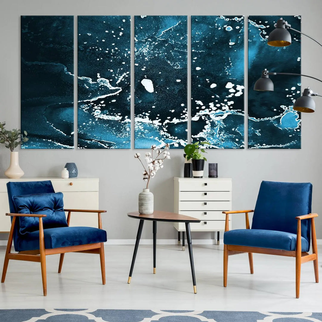 The Blue Marble Ink Splash Effect Wall Art Abstract Canvas Wall Art Print features a gallery-wrapped finish on museum-quality canvas with UV-protective coating, hanging elegantly in the room.