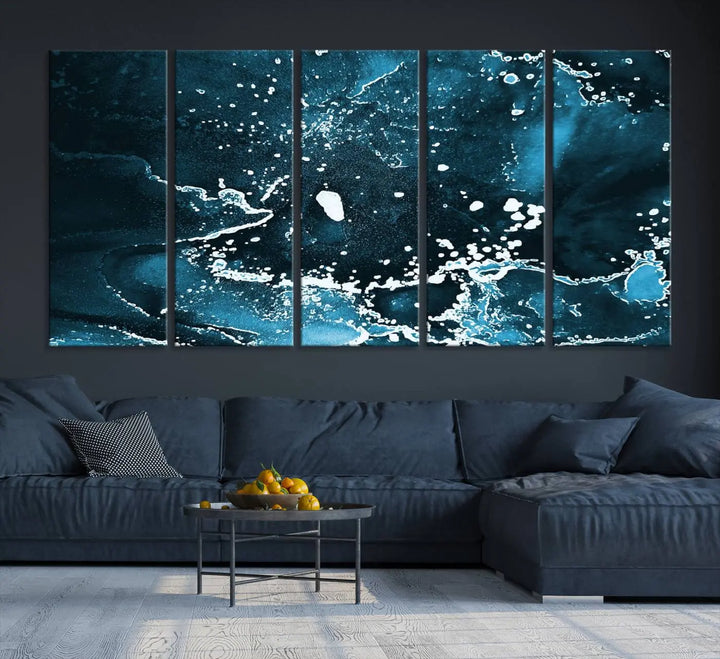 The Blue Marble Ink Splash Effect Wall Art Abstract Canvas Wall Art Print features a gallery-wrapped finish on museum-quality canvas with UV-protective coating, hanging elegantly in the room.