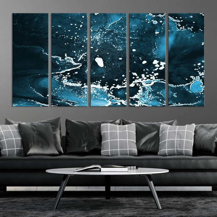 The Blue Marble Ink Splash Effect Wall Art Abstract Canvas Wall Art Print features a gallery-wrapped finish on museum-quality canvas with UV-protective coating, hanging elegantly in the room.