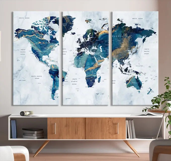 The Blue Marble Style World Map Wall Art Canvas Print, featuring three panels in blue tones, is displayed prominently.