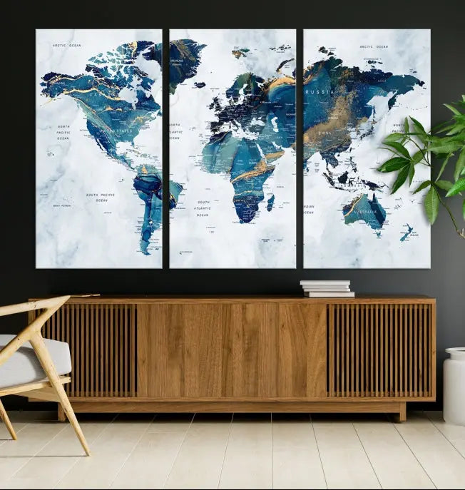 The Blue Marble Style World Map Wall Art Canvas Print, featuring three panels in blue tones, is displayed prominently.