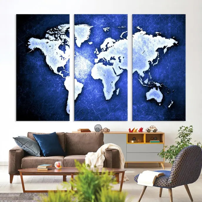 The living room features the Blue Metallic World Map Wall Art Canvas Print on a blue background, showcasing museum-quality canvases with a UV-protective coating, enhancing the modern decor.