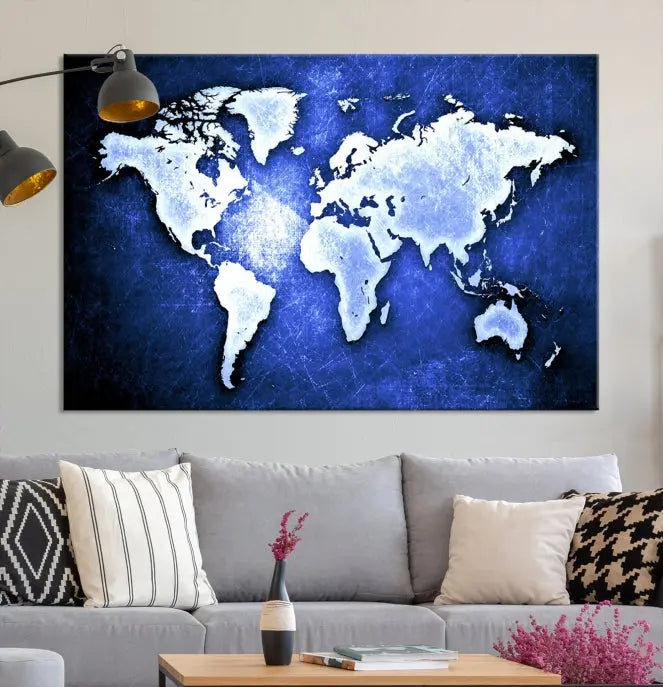 The living room features the Blue Metallic World Map Wall Art Canvas Print on a blue background, showcasing museum-quality canvases with a UV-protective coating, enhancing the modern decor.