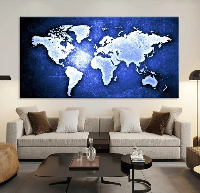 The living room features the Blue Metallic World Map Wall Art Canvas Print on a blue background, showcasing museum-quality canvases with a UV-protective coating, enhancing the modern decor.