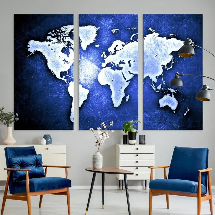 The living room features the Blue Metallic World Map Wall Art Canvas Print on a blue background, showcasing museum-quality canvases with a UV-protective coating, enhancing the modern decor.