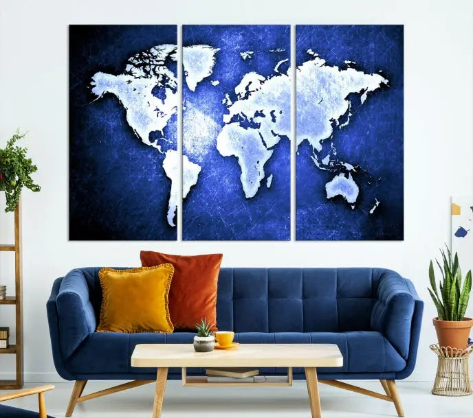 The living room features the Blue Metallic World Map Wall Art Canvas Print on a blue background, showcasing museum-quality canvases with a UV-protective coating, enhancing the modern decor.