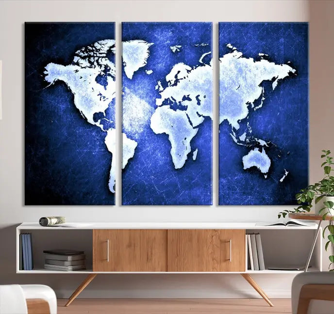 The living room features the Blue Metallic World Map Wall Art Canvas Print on a blue background, showcasing museum-quality canvases with a UV-protective coating, enhancing the modern decor.