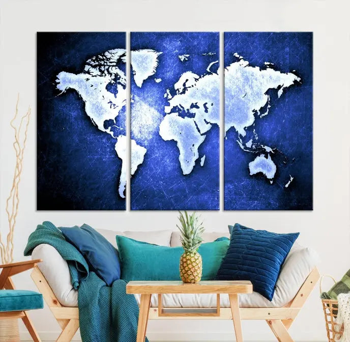 The living room features the Blue Metallic World Map Wall Art Canvas Print on a blue background, showcasing museum-quality canvases with a UV-protective coating, enhancing the modern decor.