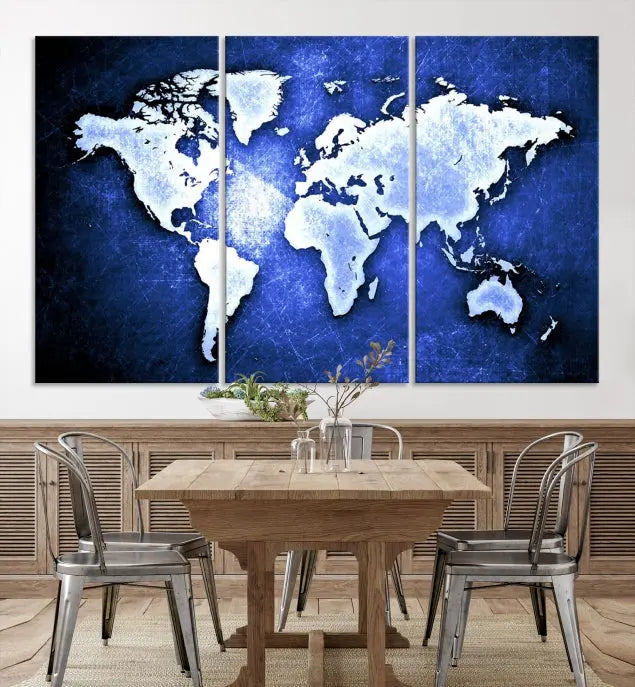 The living room features the Blue Metallic World Map Wall Art Canvas Print on a blue background, showcasing museum-quality canvases with a UV-protective coating, enhancing the modern decor.