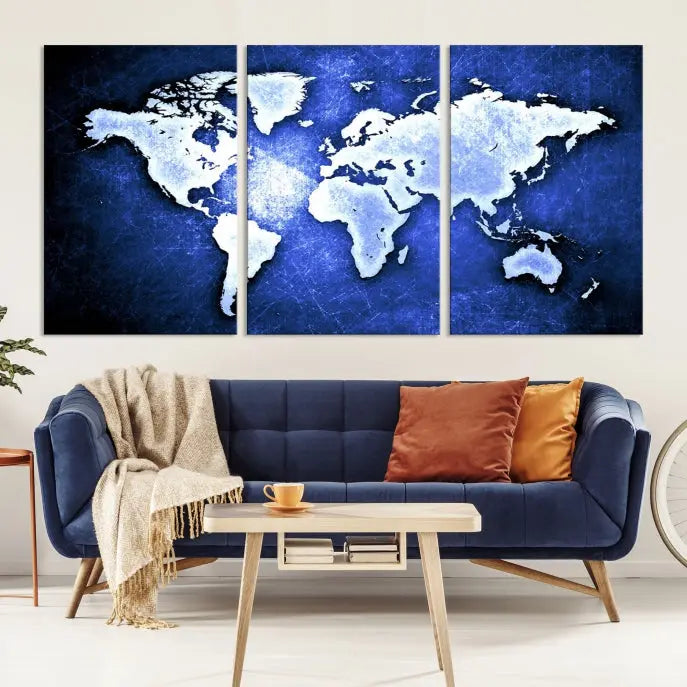 The living room features the Blue Metallic World Map Wall Art Canvas Print on a blue background, showcasing museum-quality canvases with a UV-protective coating, enhancing the modern decor.