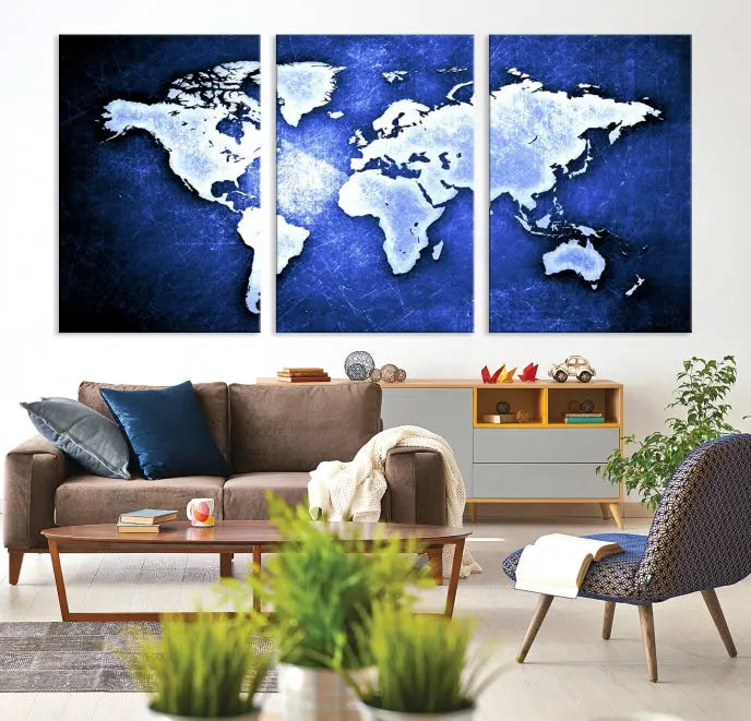 The living room features the Blue Metallic World Map Wall Art Canvas Print on a blue background, showcasing museum-quality canvases with a UV-protective coating, enhancing the modern decor.