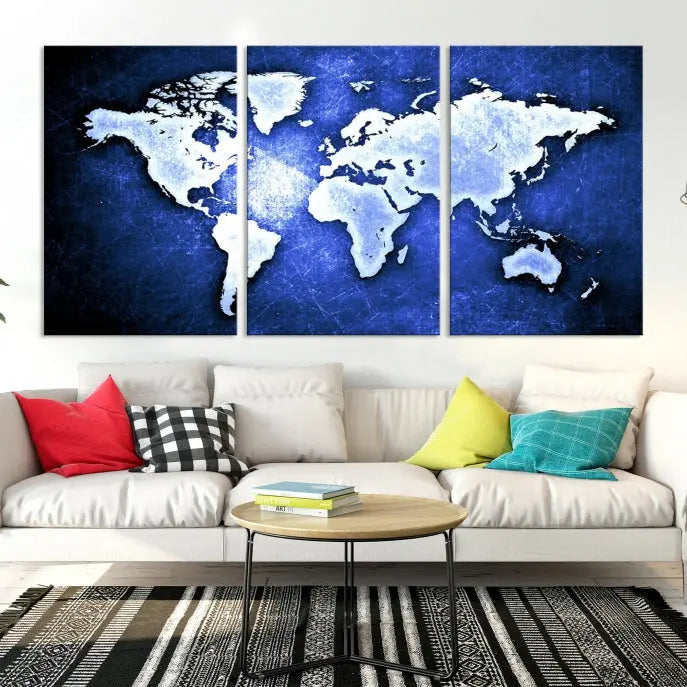 The living room features the Blue Metallic World Map Wall Art Canvas Print on a blue background, showcasing museum-quality canvases with a UV-protective coating, enhancing the modern decor.