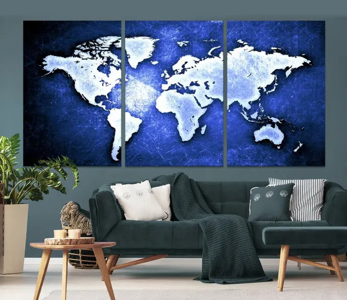 The living room features the Blue Metallic World Map Wall Art Canvas Print on a blue background, showcasing museum-quality canvases with a UV-protective coating, enhancing the modern decor.