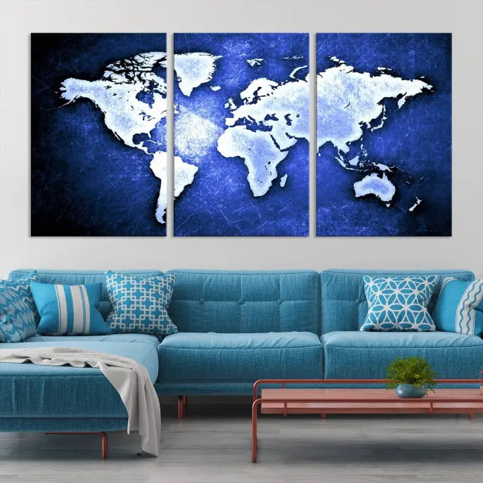 The living room features the Blue Metallic World Map Wall Art Canvas Print on a blue background, showcasing museum-quality canvases with a UV-protective coating, enhancing the modern decor.