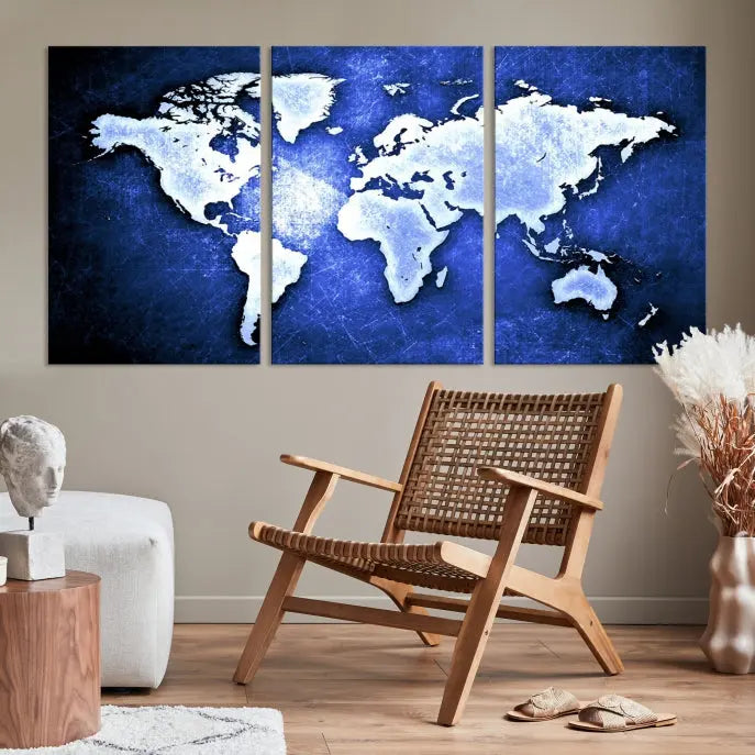 The living room features the Blue Metallic World Map Wall Art Canvas Print on a blue background, showcasing museum-quality canvases with a UV-protective coating, enhancing the modern decor.