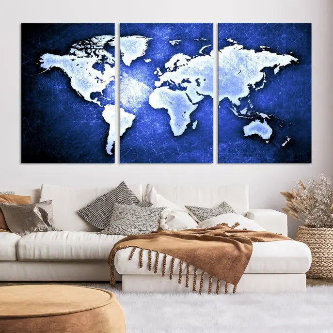 The living room features the Blue Metallic World Map Wall Art Canvas Print on a blue background, showcasing museum-quality canvases with a UV-protective coating, enhancing the modern decor.