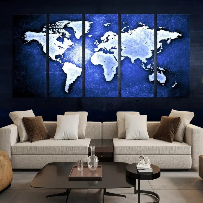 The living room features the Blue Metallic World Map Wall Art Canvas Print on a blue background, showcasing museum-quality canvases with a UV-protective coating, enhancing the modern decor.