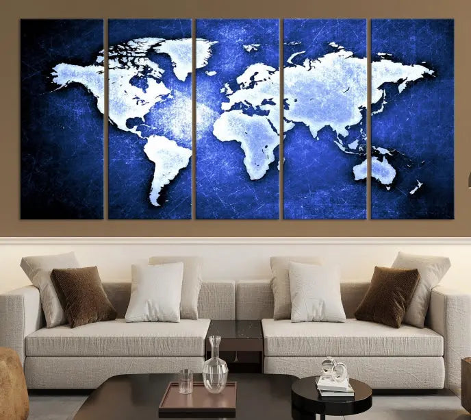 The living room features the Blue Metallic World Map Wall Art Canvas Print on a blue background, showcasing museum-quality canvases with a UV-protective coating, enhancing the modern decor.