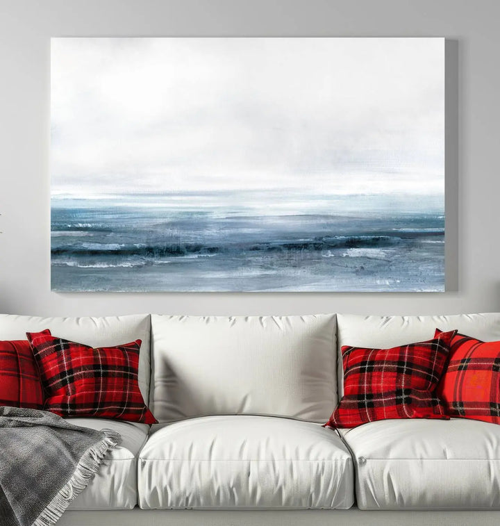 The Blue Ocean Abstract Artwork Wall Art Canvas Print, featuring museum-quality canvas with a gallery wrap and UV-protective coating, enhances the wall in a softly lit room.