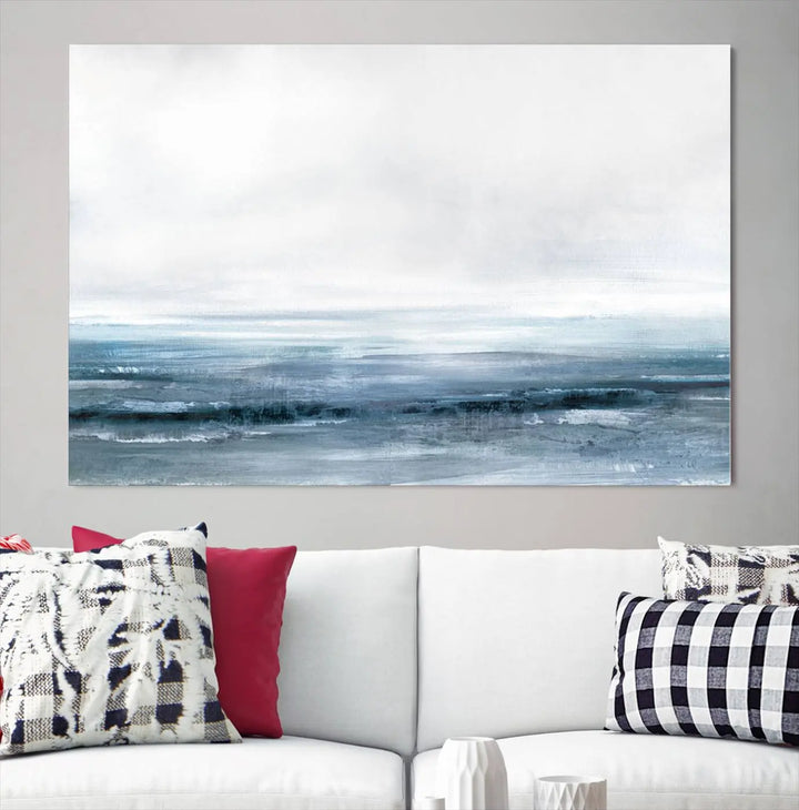 The Blue Ocean Abstract Artwork Wall Art Canvas Print, featuring museum-quality canvas with a gallery wrap and UV-protective coating, enhances the wall in a softly lit room.