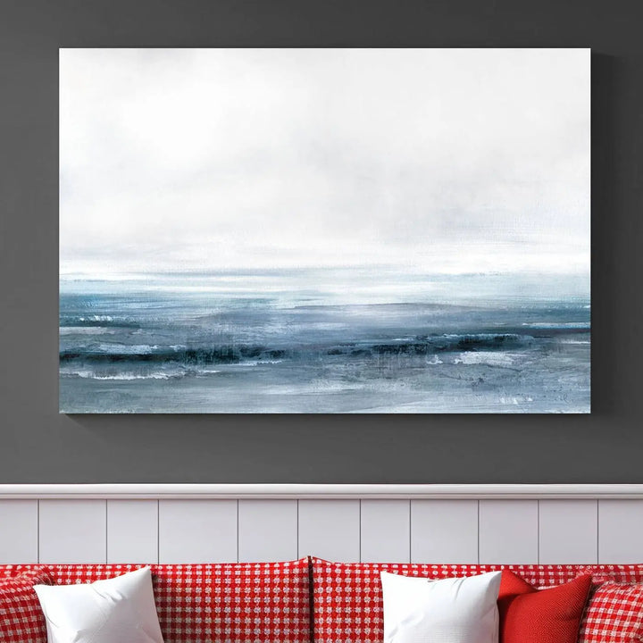 The Blue Ocean Abstract Artwork Wall Art Canvas Print, featuring museum-quality canvas with a gallery wrap and UV-protective coating, enhances the wall in a softly lit room.