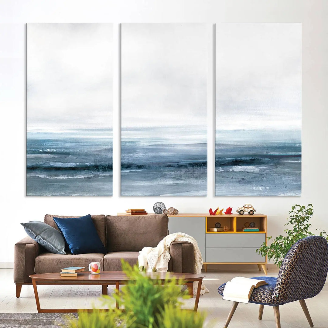 The Blue Ocean Abstract Artwork Wall Art Canvas Print, featuring museum-quality canvas with a gallery wrap and UV-protective coating, enhances the wall in a softly lit room.