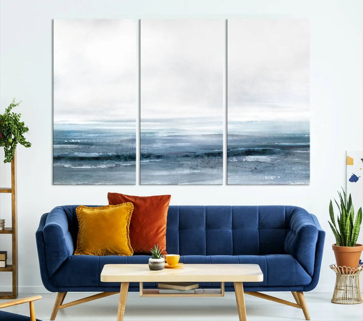 The Blue Ocean Abstract Artwork Wall Art Canvas Print, featuring museum-quality canvas with a gallery wrap and UV-protective coating, enhances the wall in a softly lit room.