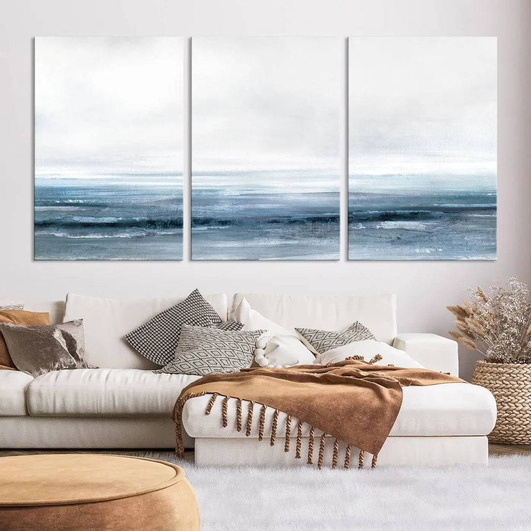 The Blue Ocean Abstract Artwork Wall Art Canvas Print, featuring museum-quality canvas with a gallery wrap and UV-protective coating, enhances the wall in a softly lit room.