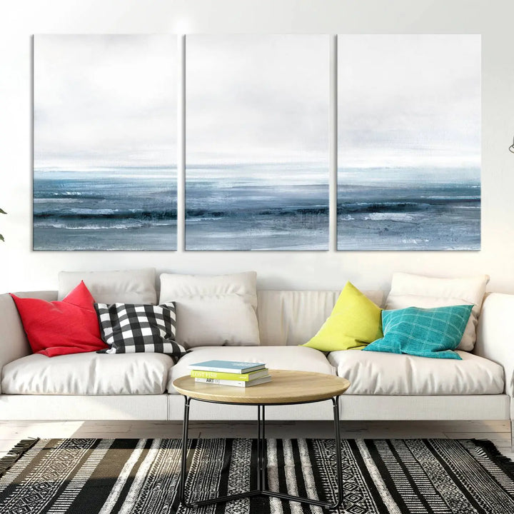 The Blue Ocean Abstract Artwork Wall Art Canvas Print, featuring museum-quality canvas with a gallery wrap and UV-protective coating, enhances the wall in a softly lit room.