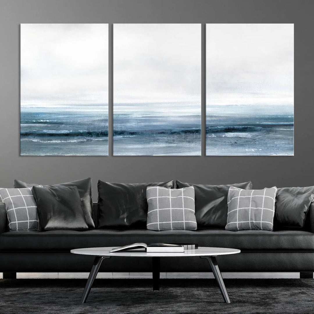 The Blue Ocean Abstract Artwork Wall Art Canvas Print, featuring museum-quality canvas with a gallery wrap and UV-protective coating, enhances the wall in a softly lit room.