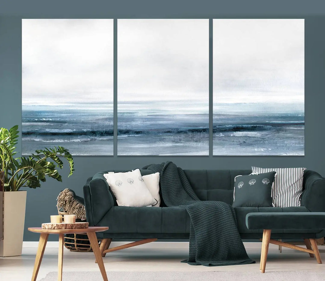 The Blue Ocean Abstract Artwork Wall Art Canvas Print, featuring museum-quality canvas with a gallery wrap and UV-protective coating, enhances the wall in a softly lit room.