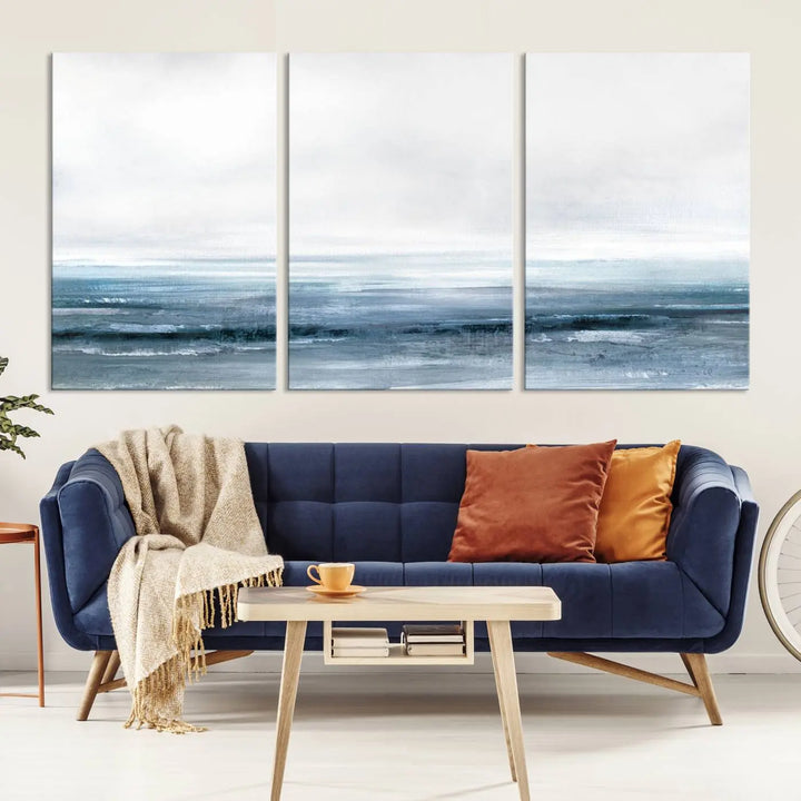 The Blue Ocean Abstract Artwork Wall Art Canvas Print, featuring museum-quality canvas with a gallery wrap and UV-protective coating, enhances the wall in a softly lit room.