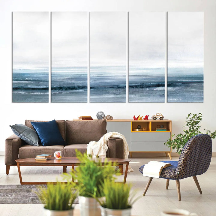 The Blue Ocean Abstract Artwork Wall Art Canvas Print, featuring museum-quality canvas with a gallery wrap and UV-protective coating, enhances the wall in a softly lit room.