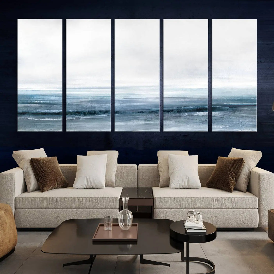 The Blue Ocean Abstract Artwork Wall Art Canvas Print, featuring museum-quality canvas with a gallery wrap and UV-protective coating, enhances the wall in a softly lit room.