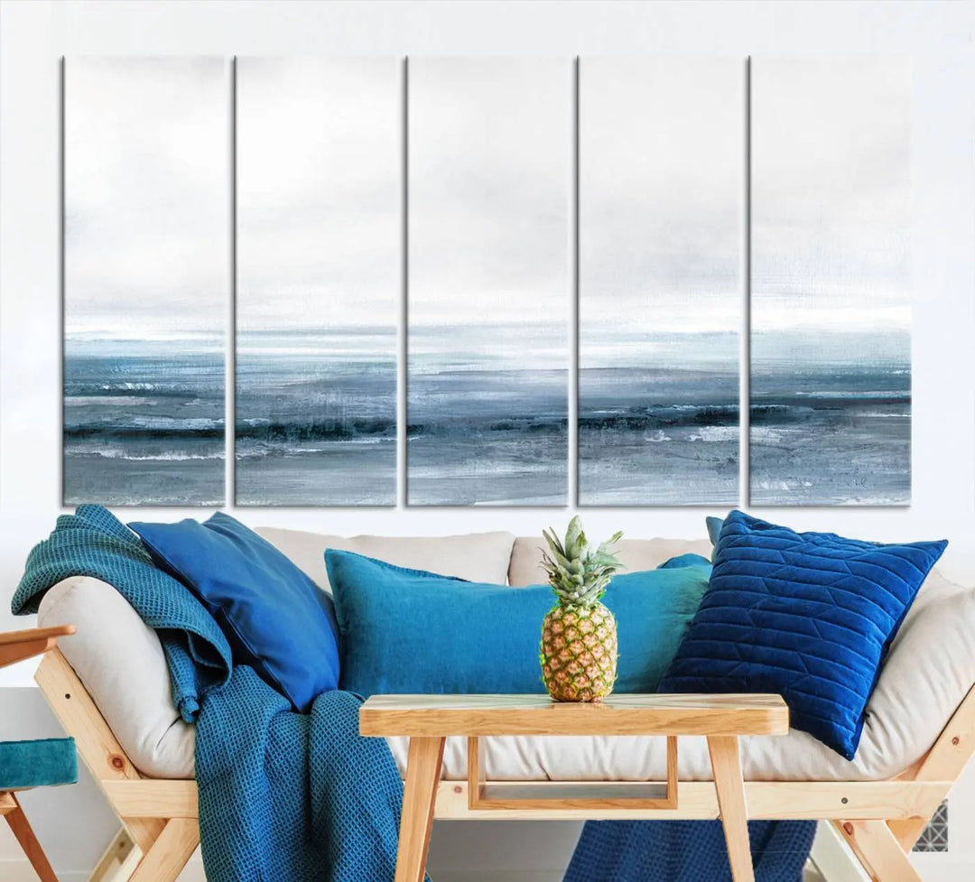 The Blue Ocean Abstract Artwork Wall Art Canvas Print, featuring museum-quality canvas with a gallery wrap and UV-protective coating, enhances the wall in a softly lit room.