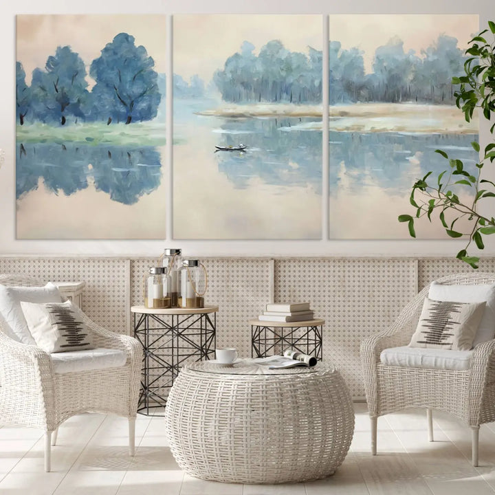 The triptych canvas print, "Blue Trees and Water Reflection Landscape," showcases a serene lake and boat scene through giclee printing. The blue trees reflecting on the water create a calming ambiance, making it an ideal choice for nature lovers.