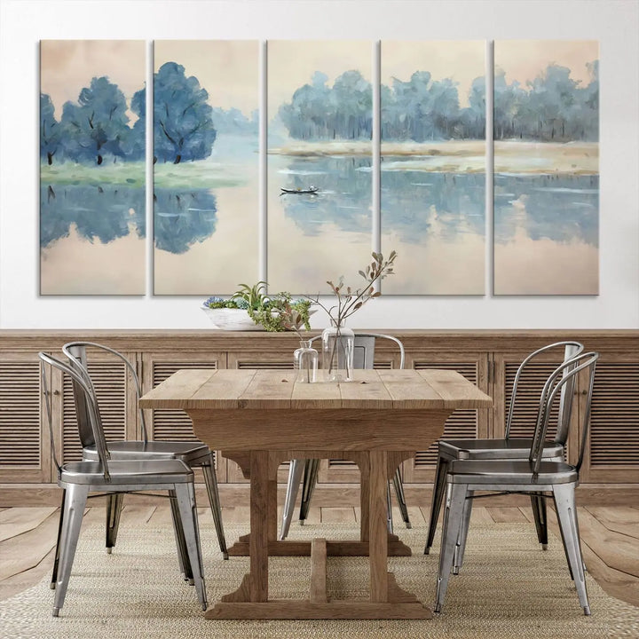 The triptych canvas print, "Blue Trees and Water Reflection Landscape," showcases a serene lake and boat scene through giclee printing. The blue trees reflecting on the water create a calming ambiance, making it an ideal choice for nature lovers.