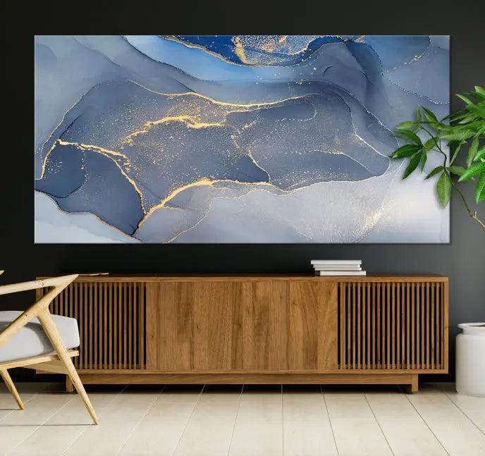 The Blue Wall Art Abstract Canvas Wall Art Print, with its striking blue and gold tones, adds an elegant touch to the room. Crafted on museum-quality canvas, this artwork is ideal for any stylish home. Enjoy the added benefit of free shipping right to your door!