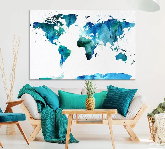 The Blue Watercolor World Map Wall Art Canvas Print features a multi-panel design in shades of blue and green, printed on museum-quality canvas with a UV-protective coating. It is ready to hang.