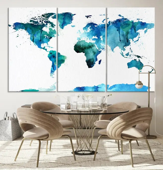 The Blue Watercolor World Map Wall Art Canvas Print features a multi-panel design in shades of blue and green, printed on museum-quality canvas with a UV-protective coating. It is ready to hang.