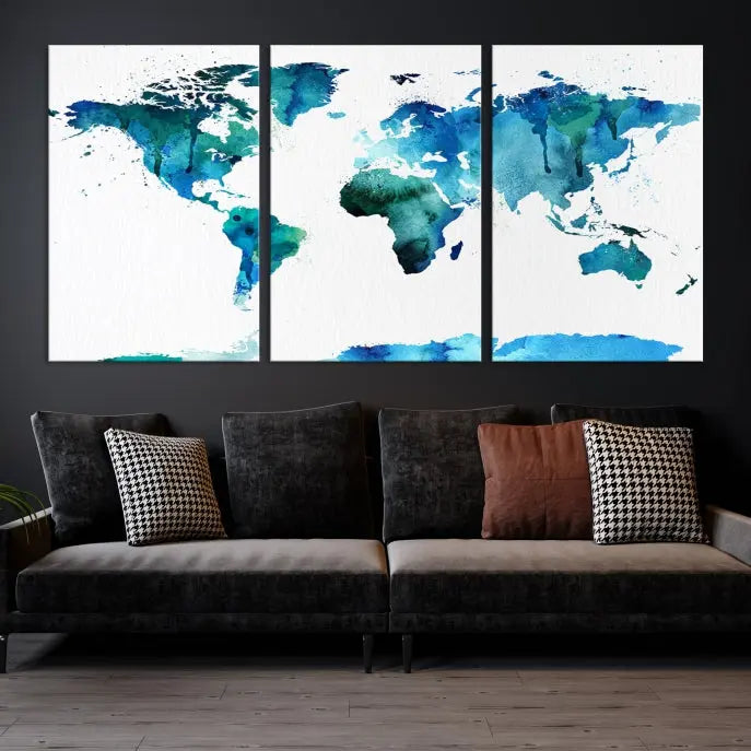 The Blue Watercolor World Map Wall Art Canvas Print features a multi-panel design in shades of blue and green, printed on museum-quality canvas with a UV-protective coating. It is ready to hang.