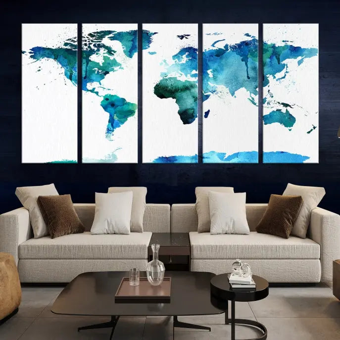 The Blue Watercolor World Map Wall Art Canvas Print features a multi-panel design in shades of blue and green, printed on museum-quality canvas with a UV-protective coating. It is ready to hang.