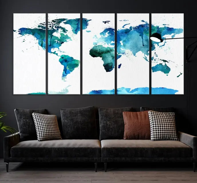 The Blue Watercolor World Map Wall Art Canvas Print features a multi-panel design in shades of blue and green, printed on museum-quality canvas with a UV-protective coating. It is ready to hang.