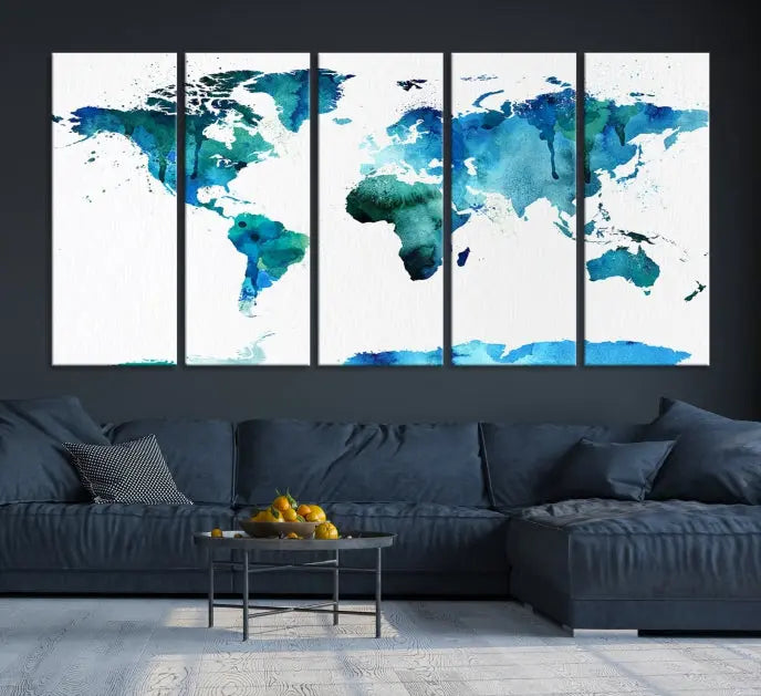 The Blue Watercolor World Map Wall Art Canvas Print features a multi-panel design in shades of blue and green, printed on museum-quality canvas with a UV-protective coating. It is ready to hang.