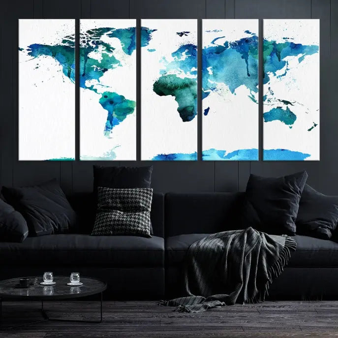 The Blue Watercolor World Map Wall Art Canvas Print features a multi-panel design in shades of blue and green, printed on museum-quality canvas with a UV-protective coating. It is ready to hang.