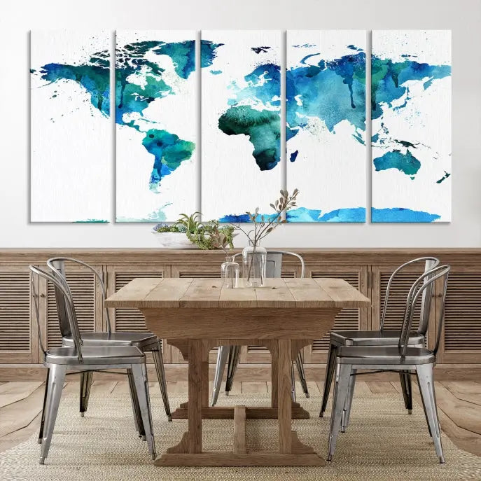 The Blue Watercolor World Map Wall Art Canvas Print features a multi-panel design in shades of blue and green, printed on museum-quality canvas with a UV-protective coating. It is ready to hang.