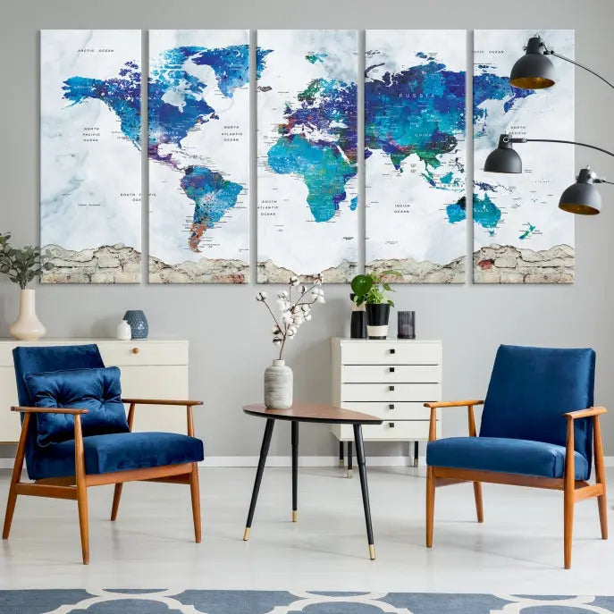 The living room features the striking Blue World Map Canvas Print—a five-panel abstract world map artwork on museum-quality canvas that is ready to hang.