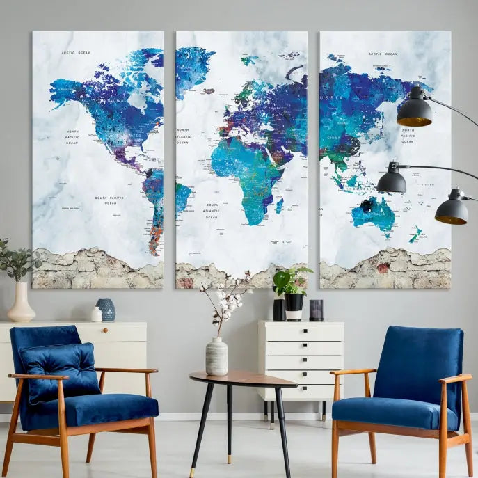 The living room features the striking Blue World Map Canvas Print—a five-panel abstract world map artwork on museum-quality canvas that is ready to hang.