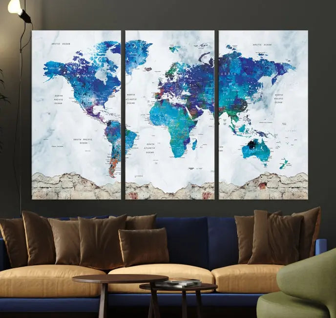 The living room features the striking Blue World Map Canvas Print—a five-panel abstract world map artwork on museum-quality canvas that is ready to hang.