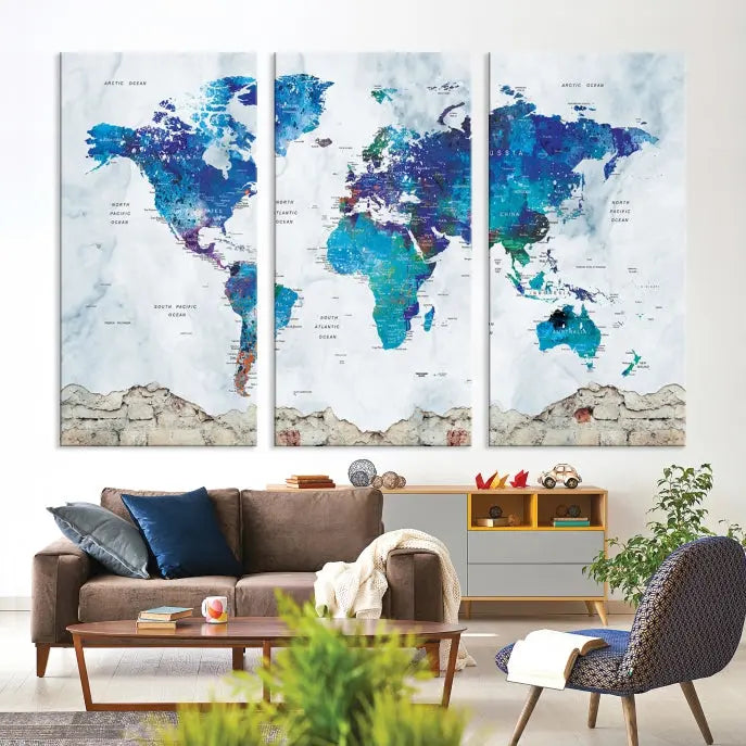 The living room features the striking Blue World Map Canvas Print—a five-panel abstract world map artwork on museum-quality canvas that is ready to hang.